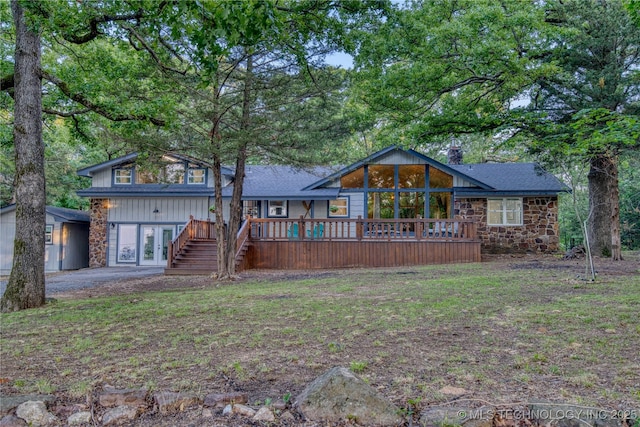 18341 W Woodhaven, Cookson, OK 74427 - view of front of house featuring stone siding, stairway, a chimney, and a wooden deck