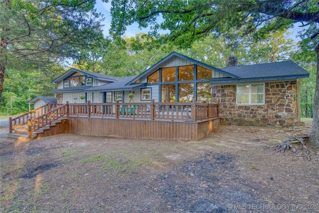 18341 W Woodhaven, Cookson, OK 74427 - back of property featuring stone siding, a chimney, a wooden deck, and roof with shingles