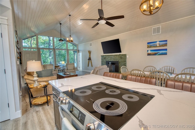 18341 W Woodhaven, Cookson, OK 74427 - kitchen with open floor plan, a chandelier, light wood-style floors, high vaulted ceiling, and ceiling fan