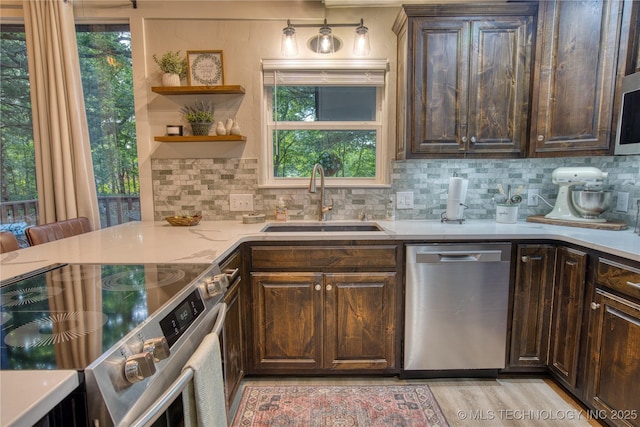 18341 W Woodhaven, Cookson, OK 74427 - kitchen featuring stainless steel appliances, a sink, backsplash, and dark brown cabinets