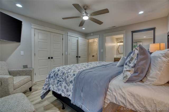 18341 W Woodhaven, Cookson, OK 74427 - bedroom featuring recessed lighting, multiple closets, light wood-style floors, ensuite bath, and ceiling fan