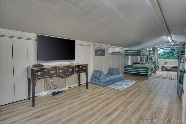 18341 W Woodhaven, Cookson, OK 74427 - bedroom with light wood-type flooring and a wall mounted air conditioner