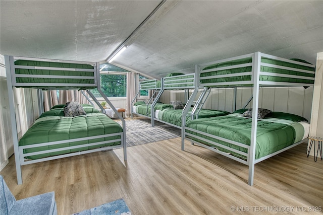 18341 W Woodhaven, Cookson, OK 74427 - bedroom featuring wood finished floors and vaulted ceiling
