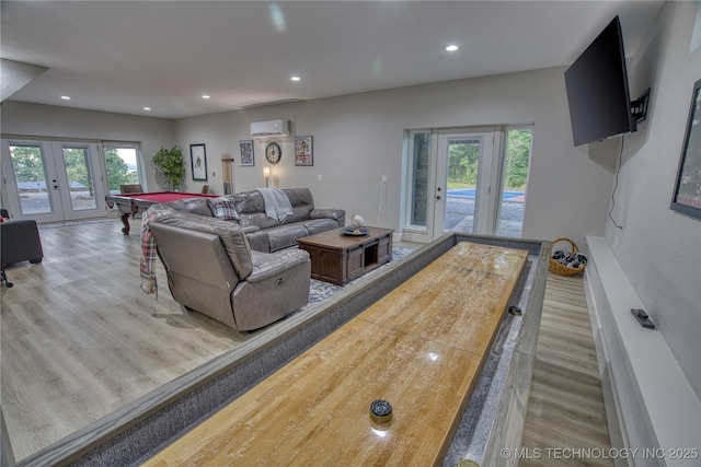18341 W Woodhaven, Cookson, OK 74427 - living area featuring a wall mounted air conditioner, french doors, wood finished floors, healthy amount of natural light, and recessed lighting
