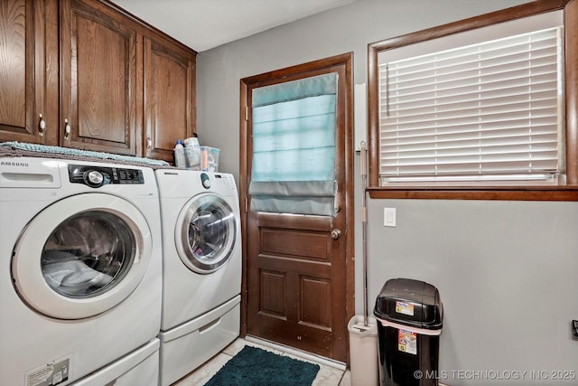 7329 E 66th Ct, Tulsa, OK 74133 - laundry area with cabinet space, washing machine and dryer, and light tile patterned flooring