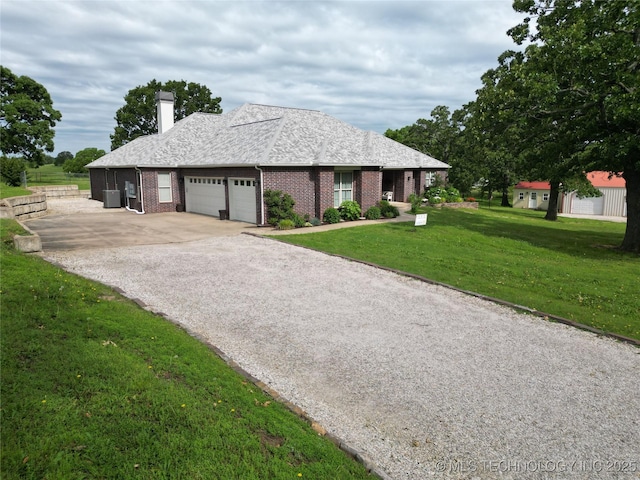 18578 S 269th E Ave, Haskell, OK 74436 - ranch-style house with a chimney, an attached garage, driveway, a front lawn, and cooling unit