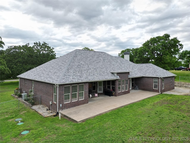 18578 S 269th E Ave, Haskell, OK 74436 - back of house with brick siding, a shingled roof, a patio, a chimney, and central air condition unit
