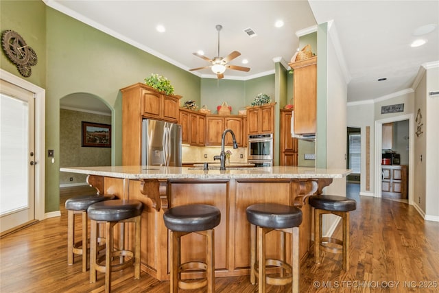 18578 S 269th E Ave, Haskell, OK 74436 - kitchen featuring stainless steel appliances, dark wood-style flooring, ceiling fan, a sink, and ornamental molding