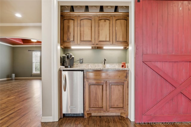 18578 S 269th E Ave, Haskell, OK 74436 - indoor wet bar featuring fridge, ornamental molding, arched walkways, dark wood-style flooring, and baseboards