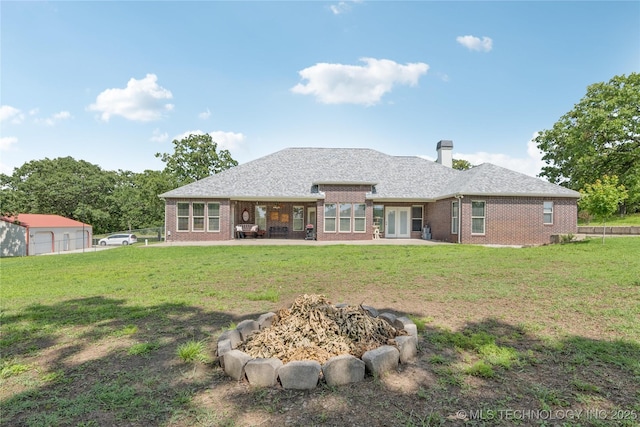 18578 S 269th E Ave, Haskell, OK 74436 - back of property with brick siding, a patio, a yard, and a chimney