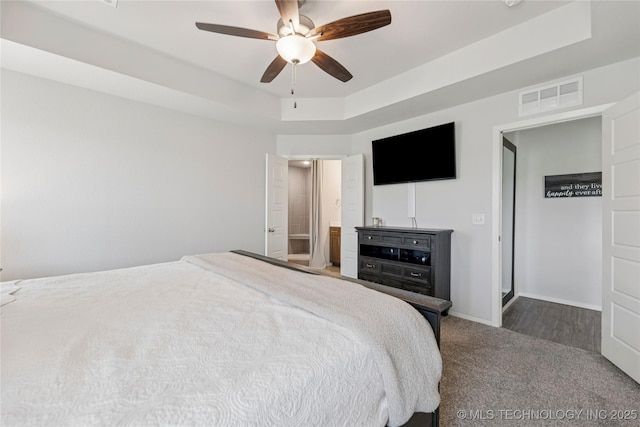 7000 S Elder Ave, Broken Arrow, OK 74011 - carpeted bedroom with a raised ceiling, a ceiling fan, and baseboards