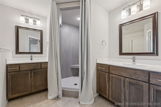 7000 S Elder Ave, Broken Arrow, OK 74011 - full bathroom with tile patterned flooring, a tile shower, two vanities, and baseboards