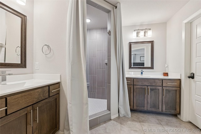 7000 S Elder Ave, Broken Arrow, OK 74011 - bathroom featuring two vanities, a tile shower, and tile patterned floors