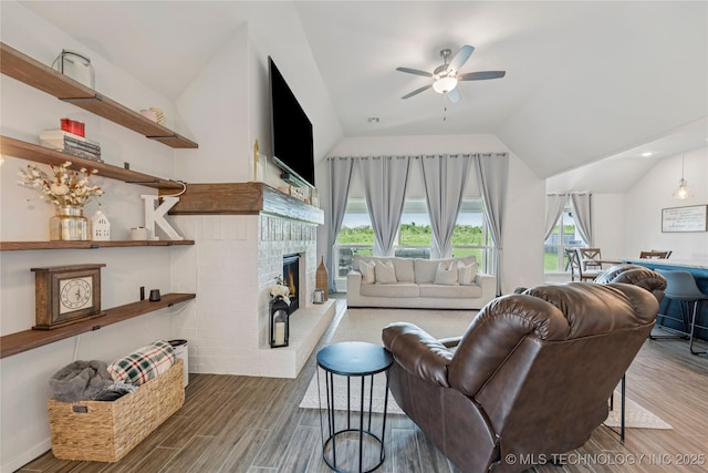 7000 S Elder Ave, Broken Arrow, OK 74011 - living area featuring lofted ceiling, ceiling fan, plenty of natural light, wood finished floors, and a fireplace