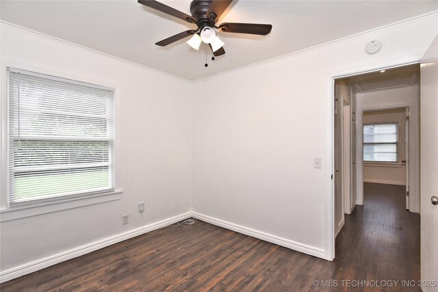 1373 E 42nd Pl N, Tulsa, OK 74105 - spare room featuring dark wood-style flooring, baseboards, a ceiling fan, ornamental molding, and attic access