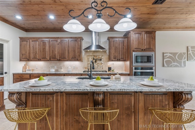 5314 E 125th St S, Bixby, OK 74008 - kitchen featuring appliances with stainless steel finishes, wall chimney range hood, light stone countertops, a kitchen breakfast bar, and wooden ceiling