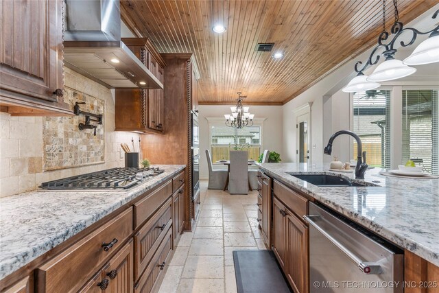 5314 E 125th St S, Bixby, OK 74008 - kitchen with appliances with stainless steel finishes, wall chimney range hood, a sink, plenty of natural light, and recessed lighting