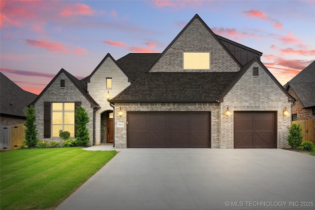 5314 E 125th St S, Bixby, OK 74008 - french country home featuring concrete driveway, a shingled roof, brick siding, an attached garage, and stone siding