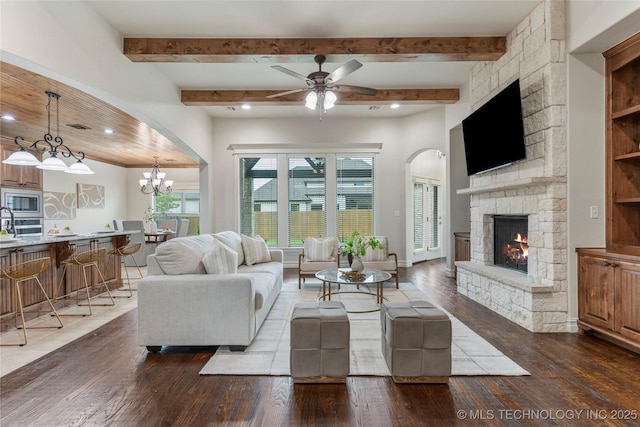 5314 E 125th St S, Bixby, OK 74008 - living area with hardwood / wood-style flooring, a stone fireplace, beam ceiling, ceiling fan, and recessed lighting