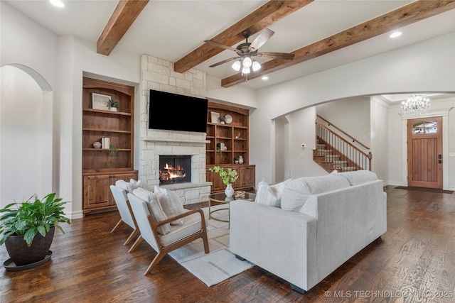 5314 E 125th St S, Bixby, OK 74008 - living room featuring arched walkways, a ceiling fan, a fireplace, dark wood-style flooring, and beamed ceiling