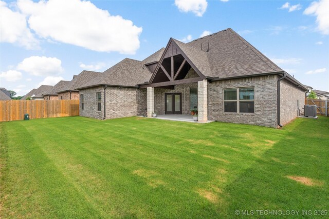 5314 E 125th St S, Bixby, OK 74008 - back of property featuring central AC, brick siding, roof with shingles, and a patio