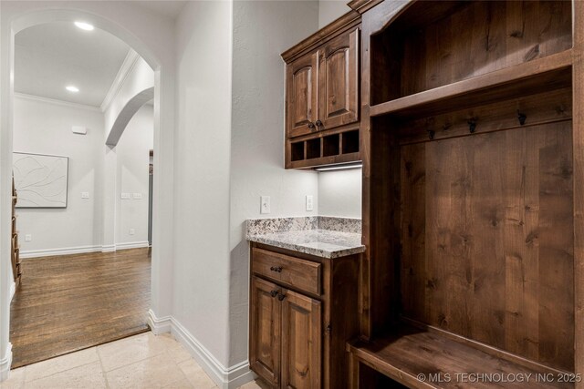 5314 E 125th St S, Bixby, OK 74008 - mudroom with crown molding, arched walkways, baseboards, and recessed lighting