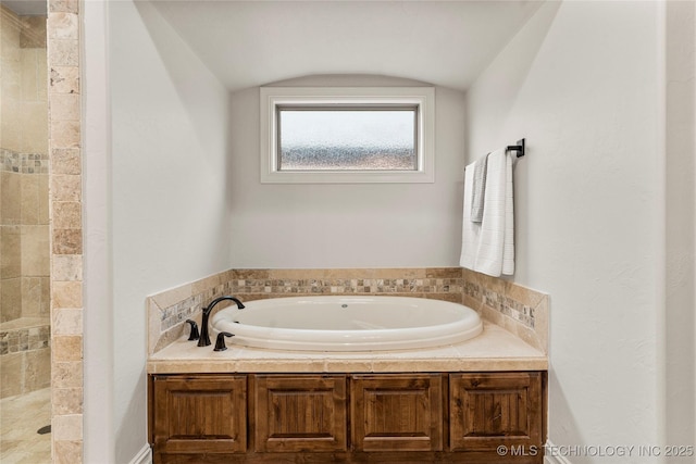 5314 E 125th St S, Bixby, OK 74008 - full bath featuring a garden tub, tiled shower, and vaulted ceiling