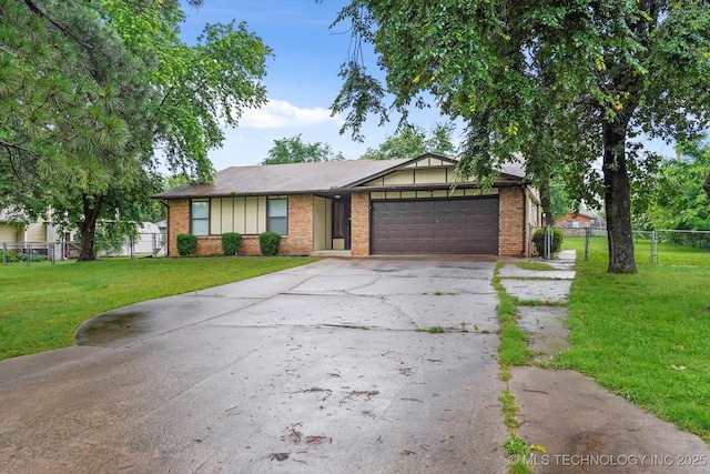 32112 E 721st Rd, Wagoner, OK 74467 - view of front facade featuring a garage, brick siding, and concrete driveway