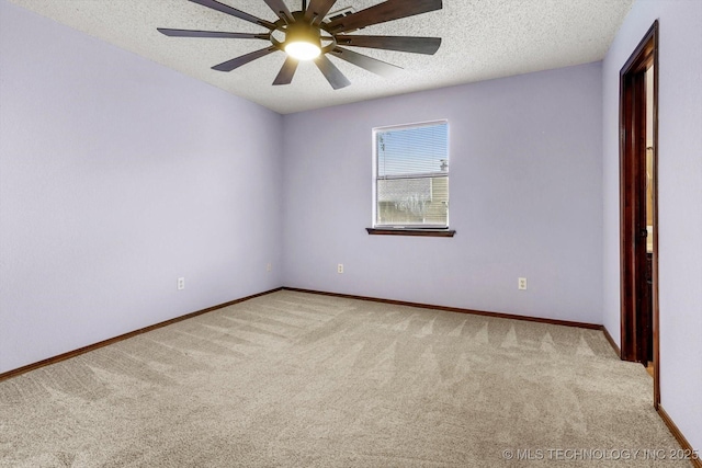 32112 E 721st Rd, Wagoner, OK 74467 - carpeted spare room with ceiling fan, baseboards, and a textured ceiling