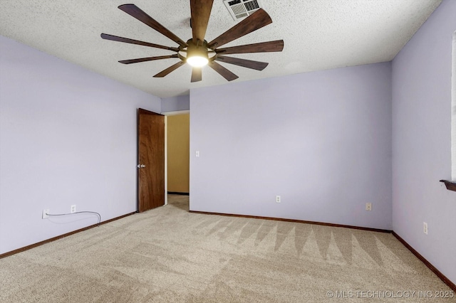 32112 E 721st Rd, Wagoner, OK 74467 - empty room with carpet flooring, ceiling fan, a textured ceiling, and baseboards