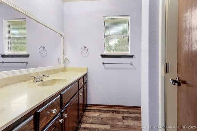 32112 E 721st Rd, Wagoner, OK 74467 - bathroom featuring vanity and wood finished floors