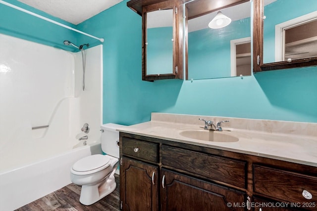 32112 E 721st Rd, Wagoner, OK 74467 - full bathroom with toilet, vanity, shower / washtub combination, and wood finished floors