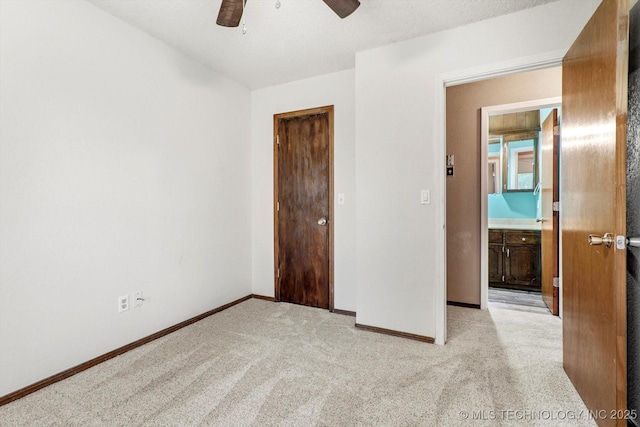 32112 E 721st Rd, Wagoner, OK 74467 - unfurnished bedroom with baseboards, light colored carpet, and ceiling fan
