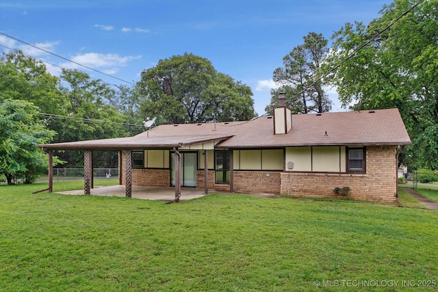 32112 E 721st Rd, Wagoner, OK 74467 - back of house featuring a patio, brick siding, a chimney, and roof with shingles