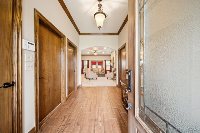 21 E 171st St S, Glenpool, OK 74033 - corridor featuring wood finished floors, arched walkways, and crown molding