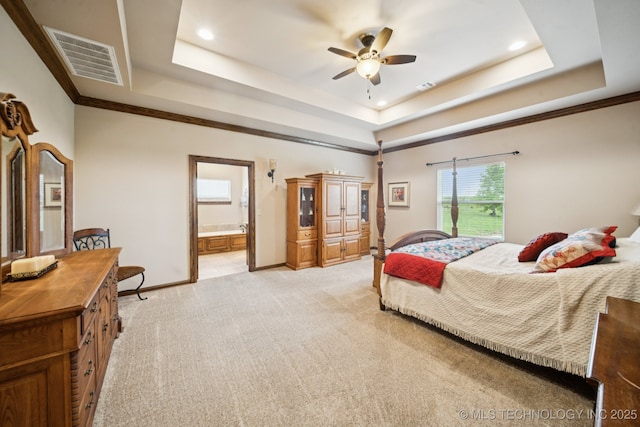 21 E 171st St S, Glenpool, OK 74033 - bedroom featuring a tray ceiling, light carpet, recessed lighting, ensuite bathroom, and baseboards