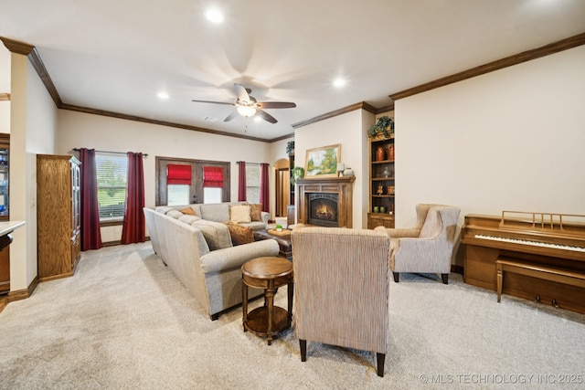 21 E 171st St S, Glenpool, OK 74033 - living area featuring light colored carpet, recessed lighting, a ceiling fan, a lit fireplace, and ornamental molding