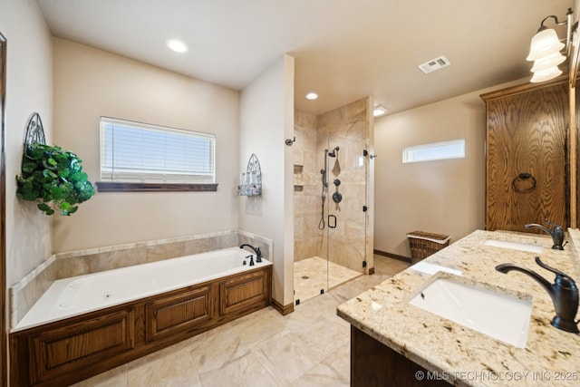 21 E 171st St S, Glenpool, OK 74033 - bathroom with a garden tub, a stall shower, plenty of natural light, double vanity, and recessed lighting