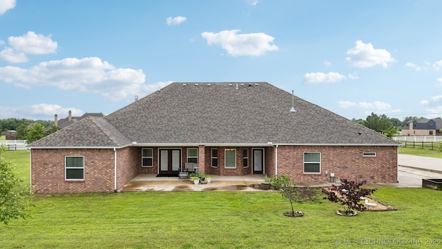 21 E 171st St S, Glenpool, OK 74033 - rear view of property featuring roof with shingles, brick siding, a patio, and french doors