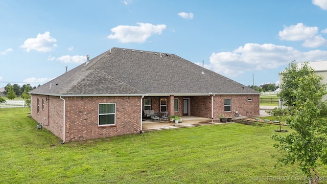 21 E 171st St S, Glenpool, OK 74033 - back of house featuring a patio area, roof with shingles, and brick siding