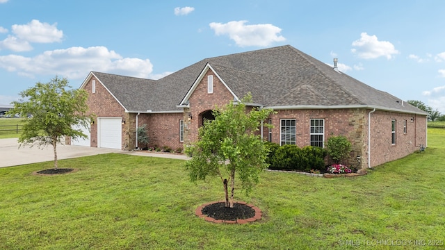 21 E 171st St S, Glenpool, OK 74033 - view of front facade featuring concrete driveway, brick siding, a shingled roof, a garage, and a front yard