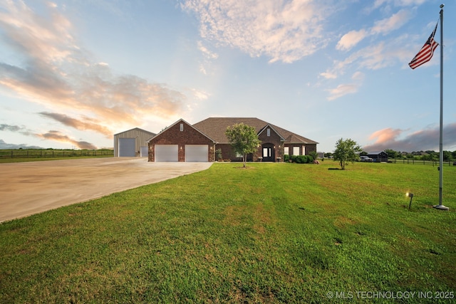 21 E 171st St S, Glenpool, OK 74033 - view of front of home featuring a garage, concrete driveway, a yard, and brick siding