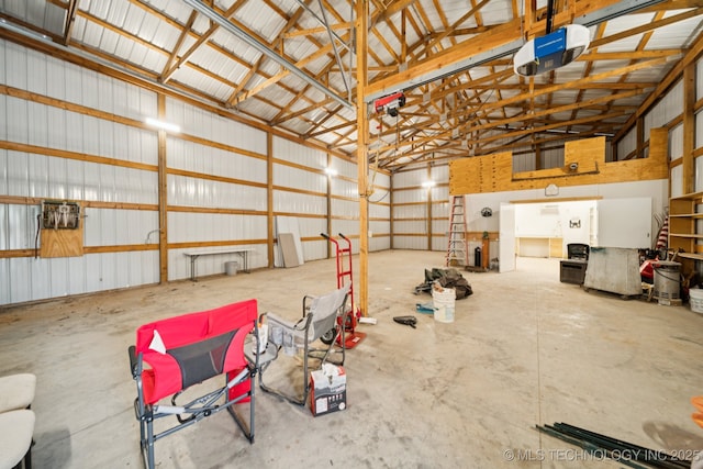 21 E 171st St S, Glenpool, OK 74033 - garage featuring a garage door opener and metal wall