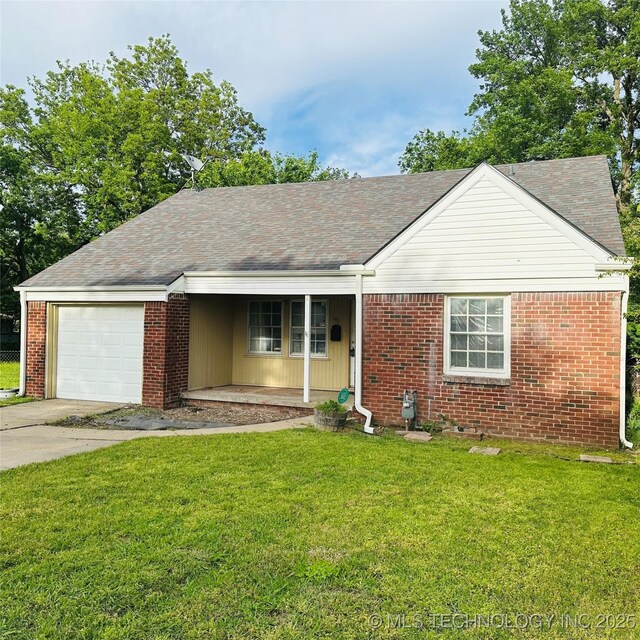 141 N College Ave, Tulsa, OK 74110 - view of front of house featuring covered porch, an attached garage, brick siding, and a front lawn