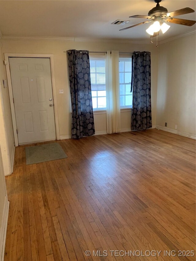 141 N College Ave, Tulsa, OK 74110 - foyer with light wood-style flooring, crown molding, and a ceiling fan