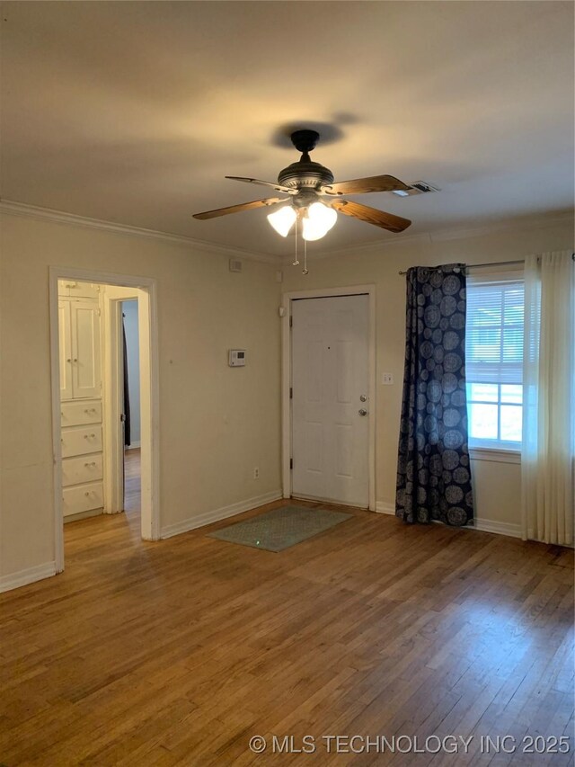141 N College Ave, Tulsa, OK 74110 - entryway featuring ornamental molding, a ceiling fan, and light wood finished floors
