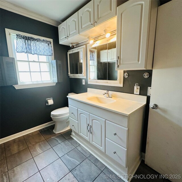 141 N College Ave, Tulsa, OK 74110 - bathroom featuring ornamental molding, vanity, and tile patterned floors