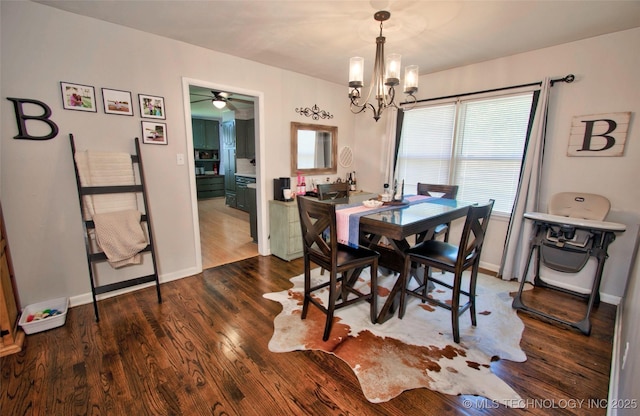 120 S Camden St, Muskogee, OK 74403 - dining room with ceiling fan, dark wood-style floors, a chandelier, and baseboards