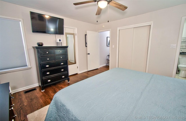 120 S Camden St, Muskogee, OK 74403 - bedroom with dark wood-style floors, baseboards, ensuite bath, and a ceiling fan