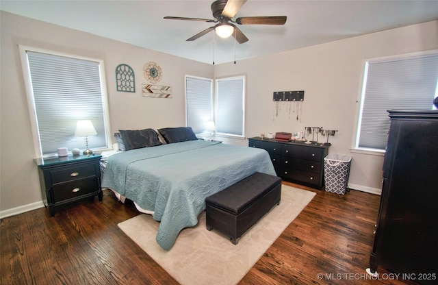 120 S Camden St, Muskogee, OK 74403 - bedroom with dark wood-type flooring, baseboards, and a ceiling fan